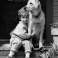 Boy hugging dog